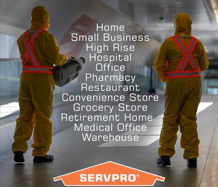Image shows 2 SERVPRO employees with their backs to the camera with a list of different commercial facilities between them.
