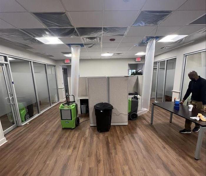Image shows a piece of SERVPRO drying equipment in an office space.